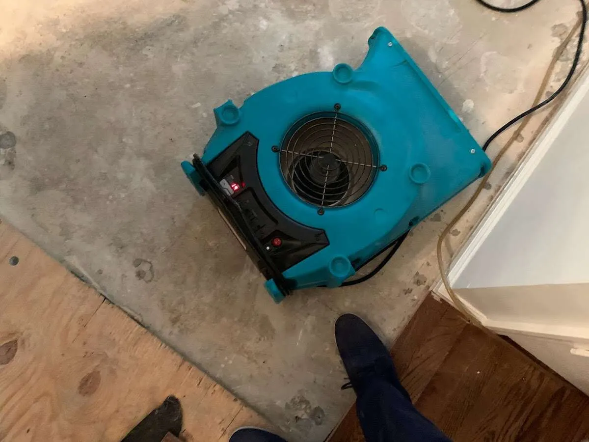 Air mover drying subfloor during Leak Detection & Repair in La Habra